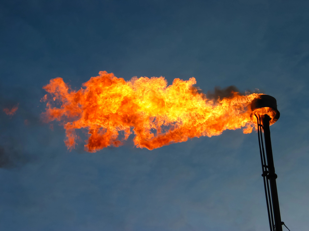 Burning oil flare